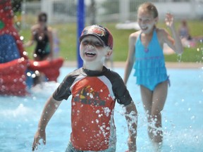 Ben Vrolyk, 4, is pictured in 2010 at the Cox Youth Centre splash pad with his cousin Grace Vrolyk, nine. The splash pad is one of several recreational amenities in Sarnia partially reopening in early August, after staying closed earlier this year amid COVID-19.