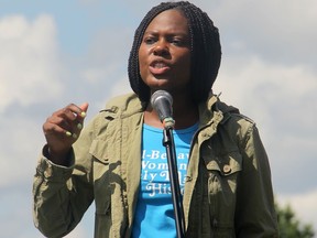 Dieulita Datus addresses crowds during the Spruce Grove anti racism rally on Saturday July 4.