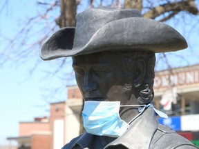 It's a sign of the times when the Stompin' Tom Connors statue on Elgin Street in Sudbury, Ont. is wearing a face mask.