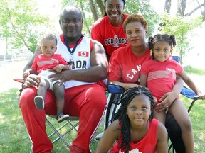 The Kemohan family -- Armel, Nelly, Shella, Ariella, Aneta and Adriel -- sport their Canada Day colours during an outing at Bell Park in Sudbury, Ontario on Wednesday, July 1, 2020. Ben Leeson/The Sudbury Star/Postmedia Network
