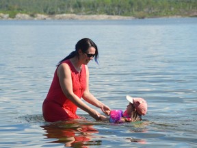 In this file photo, Stacey Bordeleau plays with granddaughter Alana Pyette-Lachapelle at the beach off Portage Avenue. Jim Moodie/Sudbury Star