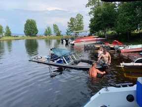 Robert Tunney's boat being pulled from the water at Post Creek Campground. Supplied