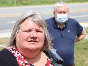 Sharon Richer, Ontario Council of Hospital Unions (OCHU/CUPE) secretary-treasurer and former Health Sciences North worker, takes part in a media conference outside the entrance to the hospital at the corner of Paris Street and Centennial Drive in Sudbury, Ont. on Wednesday July 15, 2020. Looking on is Michael Hurley, president of the Ontario Council of Hospital Unions (OCHU/CUPE).