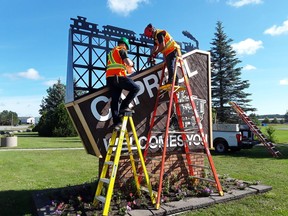 David Jobin and Eric Doni install a new sign to great visitors to Capreol. Supplied