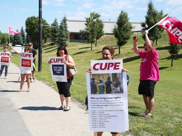 Members of CUPE Local 1623, representing various local hospital workers, take part in a rally on Paris Street near the entrance to Health Sciences North in Sudbury, Ont. on Friday July 17, 2020. The protest was part of province-wide rallies held to put pressure on the Ontario government to "restore basic workplace rights suspended for months by emergency orders during the COVID-19 pandemic. Bill 195 continues that suspension of these rights for up to 3 years," said a release from CUPE. John Lappa/Sudbury Star/Postmedia Network