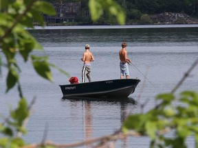 Fishermen try their luck at fishing on Ramsey Lake on Tuesday.