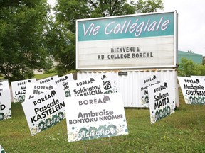 Signs featuring names of graduating students cover the grounds at College Boreal in Sudbury, Ont. on Wednesday July 22, 2020.