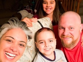 Eight-year-old Grayson, centre, and his family -- parents Sonia and Leo, and sister Solana -- were thrilled to receive a grant from the Miles Against Cancer Fund. Grayson was diagnosed with acute lymphoblastic leukemia earlier this year.