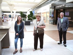 Anik Robichaud, left, of customer service at the New Sudbury Centre, and Tim Thomson, media sales consultant at The Sudbury Star, presented Joyce Corriveau with $1,000 in gift cards at the mall in Sudbury, Ont. on Thursday July 23, 2020. Corriveau is the grand prize winner  in the annual Sudbury Star Ice Guessing contest. Her guess of 10:47 a.m. on April 29, 2020, is off by just one minute. The official time is 10:46 a.m.