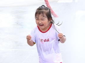 Elsa Sun, 3, cools off at the new splash pad at the Twin Forks Playground on Gary Avenue in Sudbury, Ont. on Friday July 24, 2020. The City of Greater Sudbury said in a release that this is the 15th splash pad in Greater Sudbury. Splash pads are open daily from 10 a.m. to 9 p.m. Visit www.greatersudbury.ca/splashpads for locations.