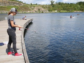 Taylor Marier tries her luck at fishing at Ramsey Lake in Sudbury, Ont. with her siblings on Tuesday July 28, 2020.