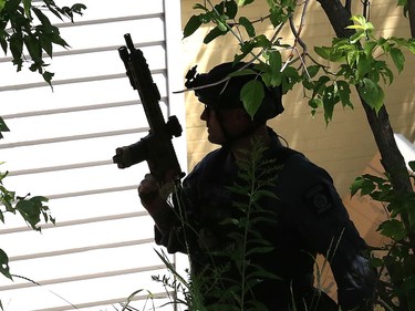 Greater Sudbury Police surrounded an apartment building on Beatty Street in Sudbury, Ont. on Thursday July 30, 2020. According to a tweet by police, just before 4:30 p.m. Thursday, tactical and K9 police officers entered a unit in the apartment building and took a 38-year-old man into custody. He is charged with numerous offences including robbery with a firearm, aggravated assault, break and enter and uttering death threats. He will attend bail court Friday. John Lappa/Sudbury Star/Postmedia Network