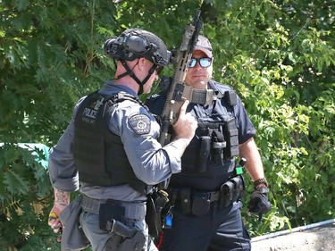 Greater Sudbury Police surrounded an apartment building on Beatty Street in Sudbury, Ont. on Thursday July 30, 2020. According to a tweet by police, just before 4:30 p.m. Thursday, tactical and K9 police officers entered a unit in the apartment building and took a 38-year-old man into custody. He is charged with numerous offences including robbery with a firearm, aggravated assault, break and enter and uttering death threats. He will attend bail court Friday. John Lappa/Sudbury Star/Postmedia Network