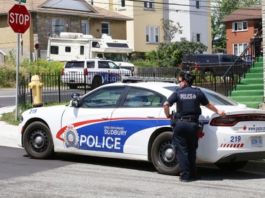 Greater Sudbury Police surrounded an apartment building on Beatty Street in Sudbury, Ont. on Thursday July 30, 2020. According to a tweet by police, just before 4:30 p.m. Thursday, tactical and K9 police officers entered a unit in the apartment building and took a 38-year-old man into custody. He is charged with numerous offences including robbery with a firearm, aggravated assault, break and enter and uttering death threats. He will attend bail court Friday. John Lappa/Sudbury Star/Postmedia Network