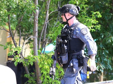 Greater Sudbury Police surrounded an apartment building on Beatty Street in Sudbury, Ont. on Thursday July 30, 2020. According to a tweet by police, just before 4:30 p.m. Thursday, tactical and K9 police officers entered a unit in the apartment building and took a 38-year-old man into custody. He is charged with numerous offences including robbery with a firearm, aggravated assault, break and enter and uttering death threats. He will attend bail court Friday. John Lappa/Sudbury Star/Postmedia Network