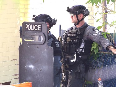 Greater Sudbury Police surrounded an apartment building on Beatty Street in Sudbury, Ont. on Thursday July 30, 2020. According to a tweet by police, just before 4:30 p.m. Thursday, tactical and K9 police officers entered a unit in the apartment building and took a 38-year-old man into custody. He is charged with numerous offences including robbery with a firearm, aggravated assault, break and enter and uttering death threats. He will attend bail court Friday. John Lappa/Sudbury Star/Postmedia Network