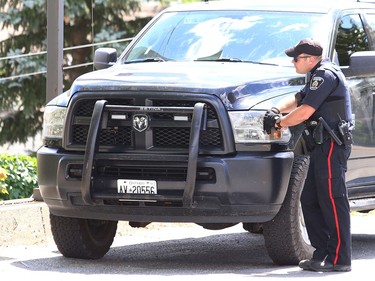 Greater Sudbury Police surrounded an apartment building on Beatty Street in Sudbury, Ont. on Thursday July 30, 2020. According to a tweet by police, just before 4:30 p.m. Thursday, tactical and K9 police officers entered a unit in the apartment building and took a 38-year-old man into custody. He is charged with numerous offences including robbery with a firearm, aggravated assault, break and enter and uttering death threats. He will attend bail court Friday. John Lappa/Sudbury Star/Postmedia Network