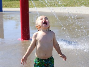 Jasper Timony, 2, cools off at the splash pad at the Kinsmen Sports Complex in Lively, Ont. on Friday July 31, 2020. John Lappa/Sudbury Star/Postmedia Network