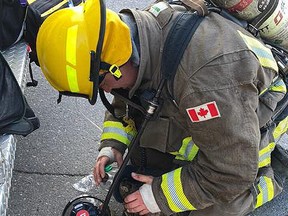 City of Greater Sudbury firefighter Joe Kerr gives oxygen using a medical pet mask to a special patient at an apartment fire July 24 on Moreau Street in Garson. Happy to report the feline is doing well and is reunited with family. Twitter