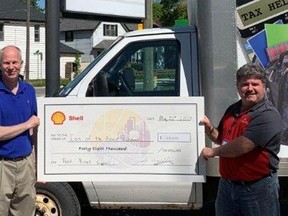 Guy Hackwell (left), general manager of Shell Manufacturing Corunna, presented a cheque to the Inn of the Good Shepherd's Myles Vanni (right) on July 8. The donation, on behalf of Shell employees and the company, will go towards supporting the Inn's many programs, including their soup kitchen meal program, which provides up to 3,000 meals per month. Handout/Sarnia This Week