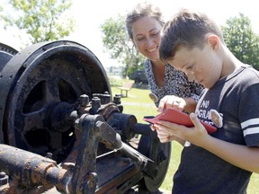 Nicole Alexander, chair at the Municipal Heritage Committee, along with her son, Hugo, team up on a scavenger hunt being jointly hosted by the Municipal Heritage Committee and the Timmins Museum from now to the end of August.

RICHA BHOSALE/The Daily Press