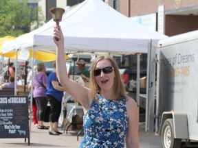 In this Daily Press file photo taken in August 2019, Eleanor Baccega, chair of Anti-Hunger Coalition Timmins, rings a bell  to officially open the Urban Market for the day. The downtown farmers' market is set to ring in a start to its season on Thursday.

The Daily Press file photo