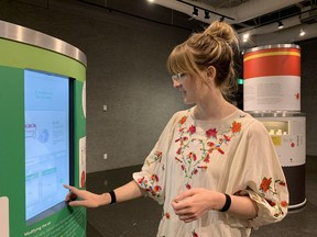 Exhibit researcher Kaitlyn Dubeau for the Timmins Museum is seen on Tuesday using an interactive touch screen on one of the displays in a new exhibit called "A Taste of Science" that explains how oxygen can help keep crops of food alive. The show will be in the museum's Grey Gallery until Nov. 22.

Elena De Luigi/The Daily Press