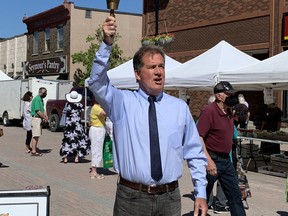 Mayor George Pirie rings the bell at this summer's second week of the Urban Park Market along Third Avenue in downtown Timmins Thursday morning. The bell is rung to signify to vendors they are able to start selling to awaiting customers. It is an old practice that Noella Rinaldo, executive director for the Downtown Timmins BIA said has been used by the market since it began. No product is allowed to be sold until the bell has been rung.

ELENA DE LUIGI/The Daily Press