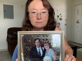 Mary Louise Foster is sitting in her apartment at her kitchen table holding a framed photograph of her and her husband Lyle on their wedding day back in July 2007. In late June this year, Lyle died after being struck by a motor vehicle at the corner of Cedar Street and Algonquin Boulevard East. He was on a late-night walk.

Elena De Luigi/The Daily Press