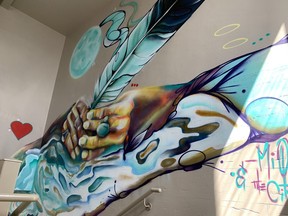 Of the various murals Mique Michelle has created throughout Timmins this summer, she said her favourite is the one seen at the entrance inside city hall, depicting two hands holding a feather.

ELENA DE LUIGI/The Daily Press