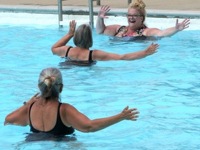 Julie Dawley leads Monday's aquafit class at the outdoor pool in Tillsonburg. (Chris Abbott/Tillsonburg News)