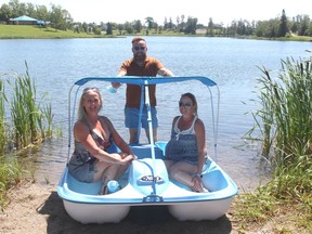 Through the generous donation from MIRO Construction, locals and visitors can enjoy Lake Commando more this summer and for years to come. Tia Lajeunesse, (left) seated with Lynn Chapleau, was on hand to present the REC department with three Pelican pedal boats. Shea Henderson (back) accepted the gift on behalf of the community. 
.TP.jpg