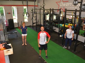 Owen Sound Fitness and Training invited members back inside on Friday under Ontario's Stage 3 reopening. From left are, CrossFit Level 1 trainer Lisa Adams, owner/operator Josh Burnett and personal trainer/nutrition coach Kat Ruck. Rob Gowan/The Sun Times