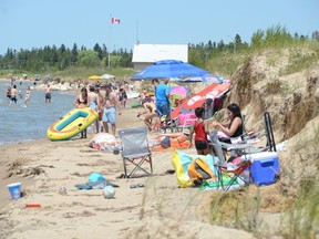 Beachgoers return to Sauble Beach on July 4 after South Bruce Peninsula council reopened beaches in the municpality the day before.