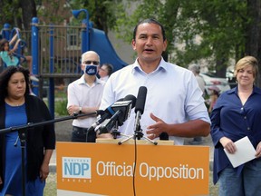 NDP Leader Wab Kinew speaks during a press conference to release an alternative plan for Manitoba schools at Vimy Ridge Park in Winnipeg on Tuesday.
