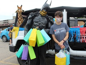 "Brantford Batman," also known as Damian Wayne, organized Sunday's UnBirthday Party Parade through the city. The parade drove past the homes of children who haven't had many visitors since the pandemic began in March. With Wayne is Kaitlin Coghlin of Brantford who inspired the Friends 4 Kindness group.