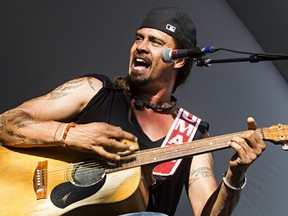 Michael Franti performs during the Edmonton Folk Music Festival in Gallagher Park in Edmonton, Alta., on Saturday, Aug. 9, 2014.  Franti will be part of the musical lineup for the Un-Festival, which streams live on Aug. 15 at 7 p.m.