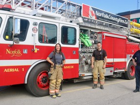 The Norfolk County Fire Department is looking for 22 individuals able to fill volunteer positions across the community. Marcia VanHaverbeke and Doug Rixmann, both volunteers at the Simcoe location, stand with Deputy Chief Scott Pipe at the fire station on Culver Street. (ASHLEY TAYLOR)