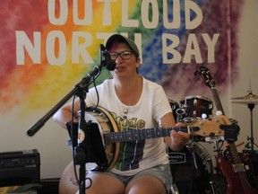 Esther Pennell, a local musician performs a few songs during the official opening of OUTLoud North Bay Friday morning. OUTLoud is a safe space  for the LGBTQ2S youth within the North Bay community and is located at 207 Ferguson Street Suite 3.