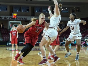 Samantha Cooper (11) of the Fairfield University women's basketball team, drives against a Boston College player at Conte Forum in Chestnut Hill, Mass. on Dec. 3, 2017.