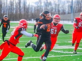 Former Warriors wide receiver Caiden Gruending (pictured carrying the ball) in Mighty Peace Football League action against the Sexsmith Sabres last season at CKC Field. The six-foot-four wideout signed on with the Okanagan Sun of the British Columbia Football Conference.