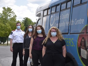 The Oxford County Community Health Centre will be launching a mobile health outreach bus this fall. Pictured, the team working on the bus: Outreach worker Amanda Cook, nurse practitioner Jennifer Stock, nurse Sarah Irwin and paramedic Ryan Orton. (Kathleen Saylors/Woodstock Sentinel-Review)