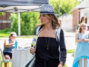 Gentry Manor held an outdoor and socially-distant fashion show Friday. The models held numbers which allowed guests to order clothing from their tables. (Handout/Postmedia Network)