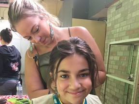 Liz Roelands works on actress Michela Luci’s hair for the show Dino Dana. Roelands recently won a Daytime Emmy for her work on the kids’ television program. Submitted