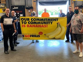 Members of the Captain Kidd Days organizing committee receive a donation from Corunna’s Rob’s No Frills on Aug. 6. Handout/Sarnia This Week