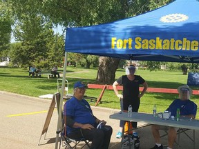 Fort Saskatchewan Rotary Club members Ted Griffiths and Stew Hennig are pictured manning the Rotary Club entrance of the Farmer’s Market this July. The local Club announced their diversity and inclusion statement early this week. Photo Supplied.