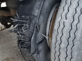 Woodstock police laid charged after an officer saw a commercial vehicle travelling with this unsafe tire on the road. (Woodstock Police)