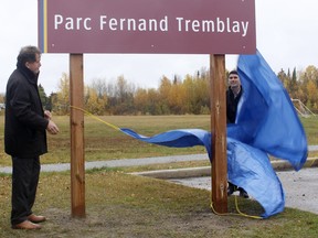 Mayor George Pirie, left, and Ward 1 Coun. Rock Whissell unveiled a sign at Fernand Tremblay Park in October 2019. City council has delayed a decision on whether to sell off parcels of land on the edge of the park until it can hear directly from applicants. FILE PHOTO/THE DAILY PRESS/POSTMEDIA NETWORK