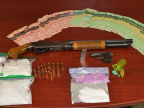 Chatham-Kent police provided this photo of drugs, weapons and money seized after two people were arrested at a Park Street residence in Chatham Wednesday night.
