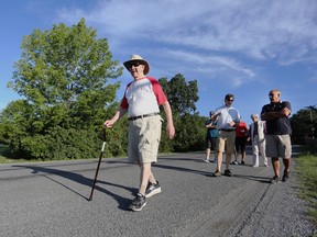 Doug Knowles completed his 92nd and final kilometre in Kingston on Wednesday in a one-kilometre-per-day fundraising walk that he decided to pursue on his 92nd birthday. Friends and supporters walked with him to mark the completion of his mission. Knowles has raised more than $3,000 for the Partners in Mission Food Bank and also money for Wounded Warriors Canada. (Meghan Balogh/The Whig-Standard)